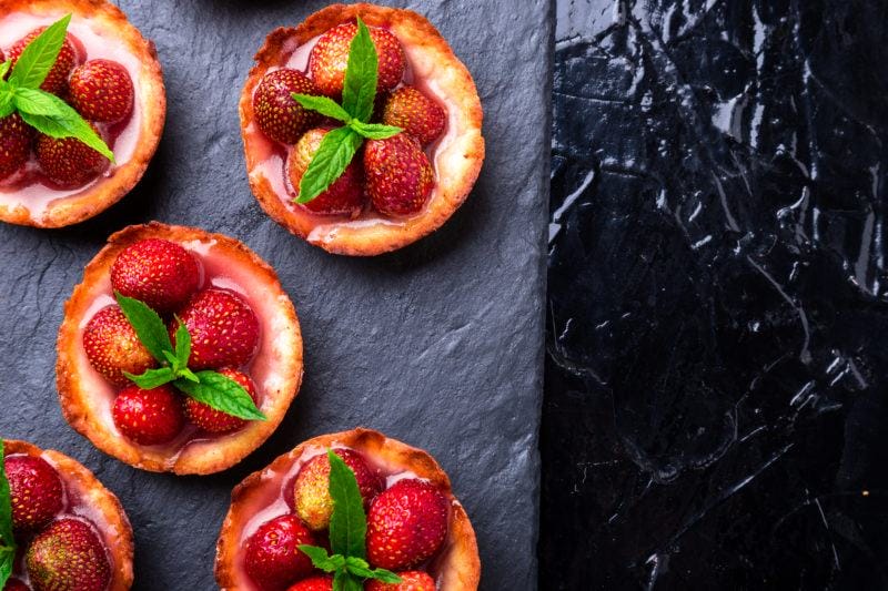 Homemade Strawberries Tarts On Slate Plate, Black Background. Top View.