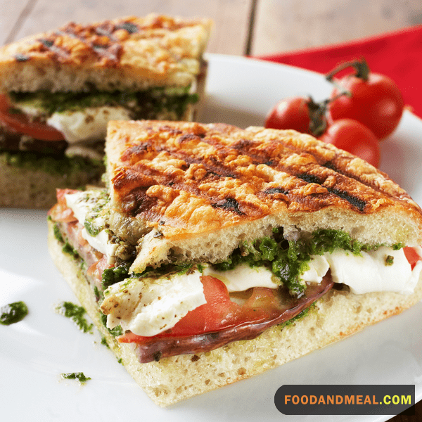 Close-up: A peak into the cheesy, pesto-filled heart of our sandwich.