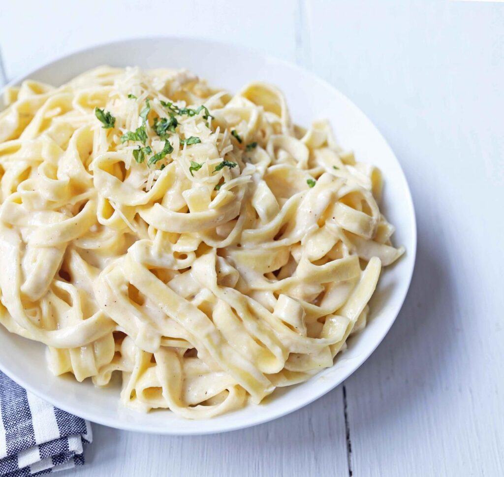 The Silken Strands: Fresh Fettuccine Awaiting Its Creamy Destiny.