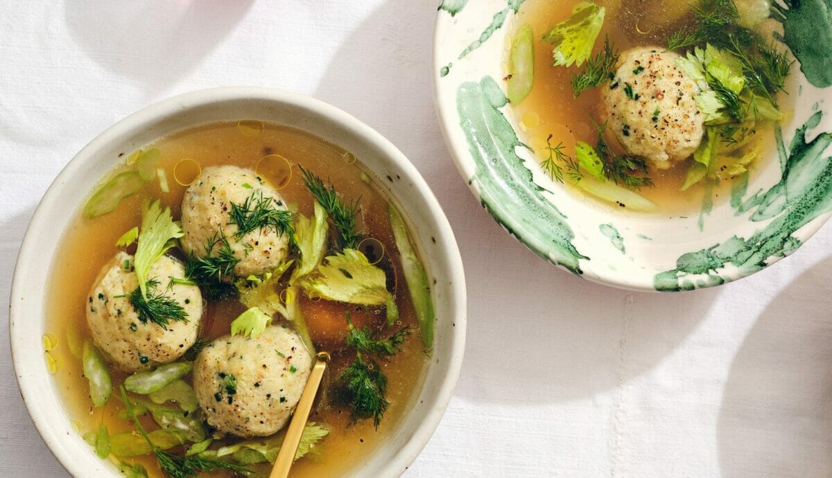 Matzo Balls Gently Bobbing In Golden Broth – A Picture Of Culinary Comfort.