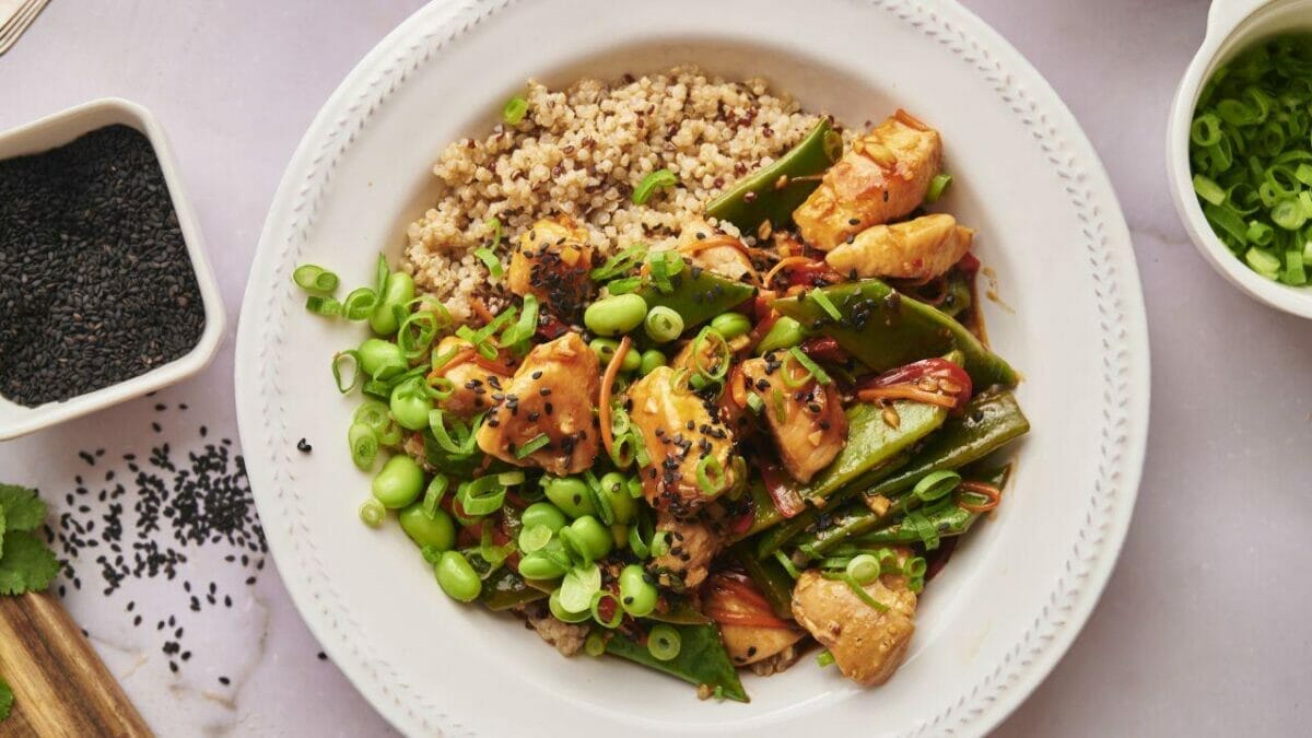 Bento-Style Lunch Ensemble: "Lunchtime upgrade – a Teriyaki Chicken Quinoa Bowl to fuel your day."