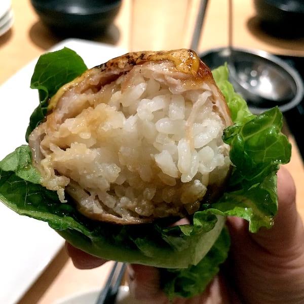 How to make Chashu Onigiri - Pork Belly Rice Ball 8 Serving elegance: Onigiri presented on a bamboo leaf.