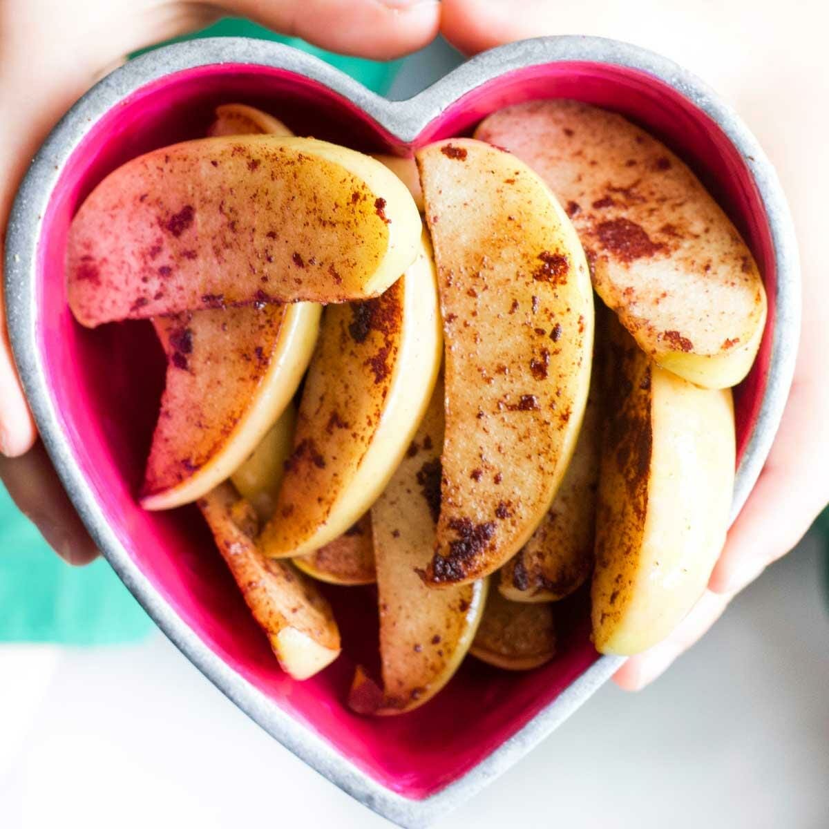 A Symphony Of Flavors: Cinnamon-Coated Apple Slices Ready For The Microwave.