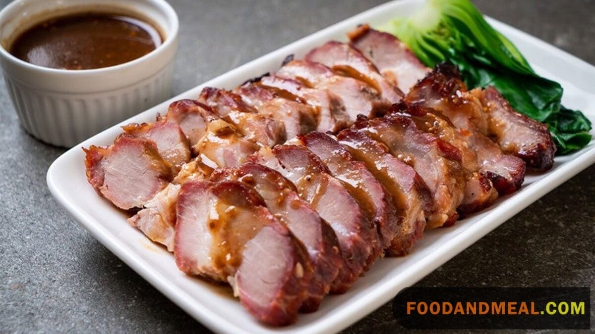 A Close-Up Shot Capturing The Mouthwatering Juiciness Of Char Siu Pork, Ready To Tantalize Taste Buds.