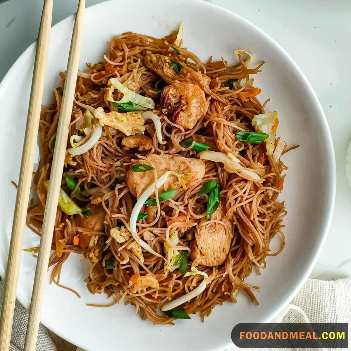 Close Up Shot Highlighting The Thin And Wispy Dried Rice Vermicelli Noodles, A Key Ingredient In Singapore Bee Hoon. Be Sure To Use The Thin 1-2Mm Wide Noodles.